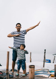 Father and son playing