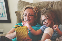 Mother and daughter working on a tablet